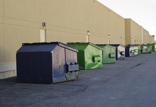 construction dumpsters stacked in a row on a job site in Elkhorn